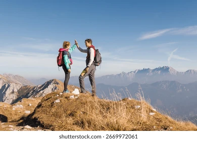 Couple enjoying romantic sunset in mountains
